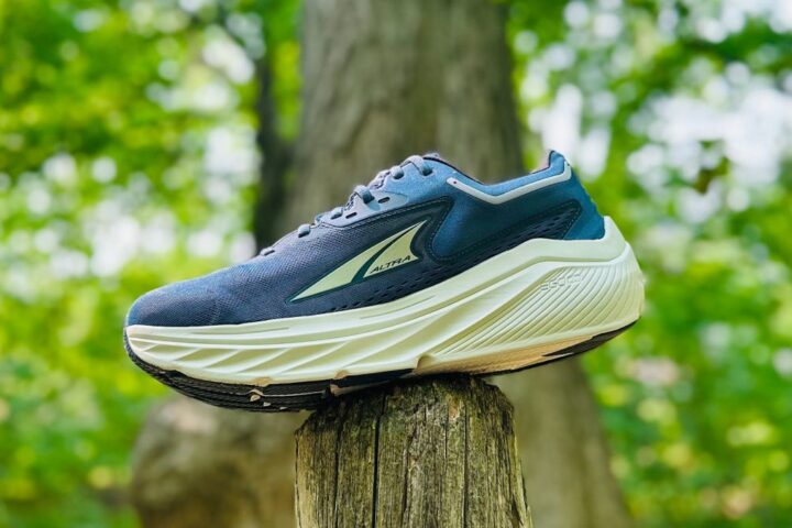 Altra Via Olympus zero-drop running shoe perched on a fence post