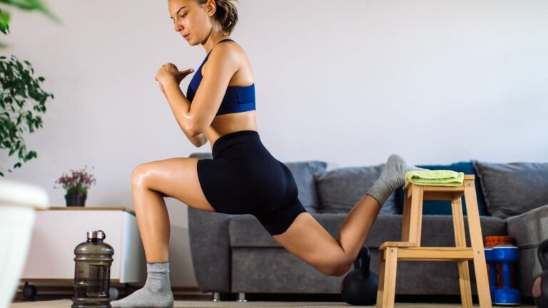 Woman performing high knee hold