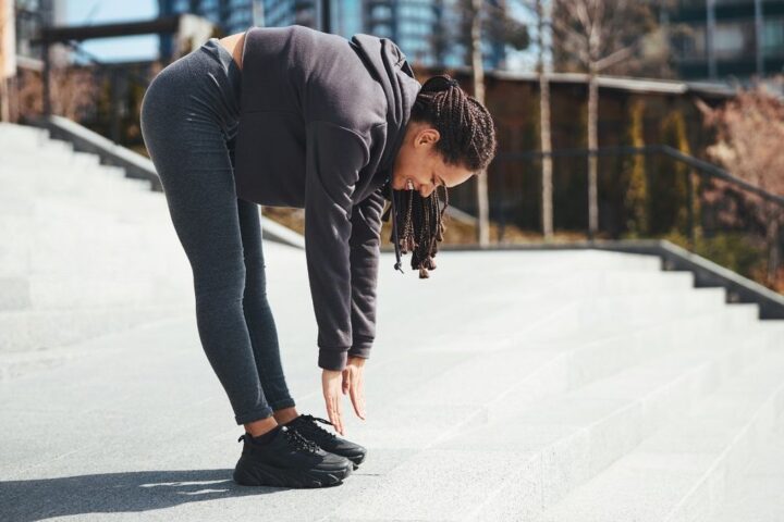 Woman performs roll down exercise